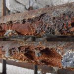 What is the effect of rusting on steel reinforcement?